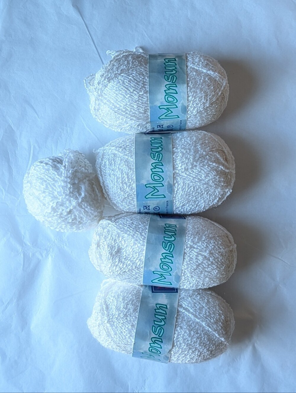 4 full skeins and one partial skein of Monsun white yarn
